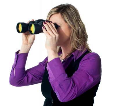 Businesswoman Looking Through Binoculars